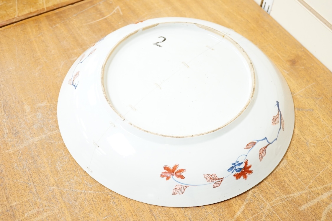Three early 18th century Chinese Imari dishes (one clobbered), largest 46.5cm, together with a 19th century Chinese powder blue ground vase, 44cm high and a horn carving, 13.7cm (5)